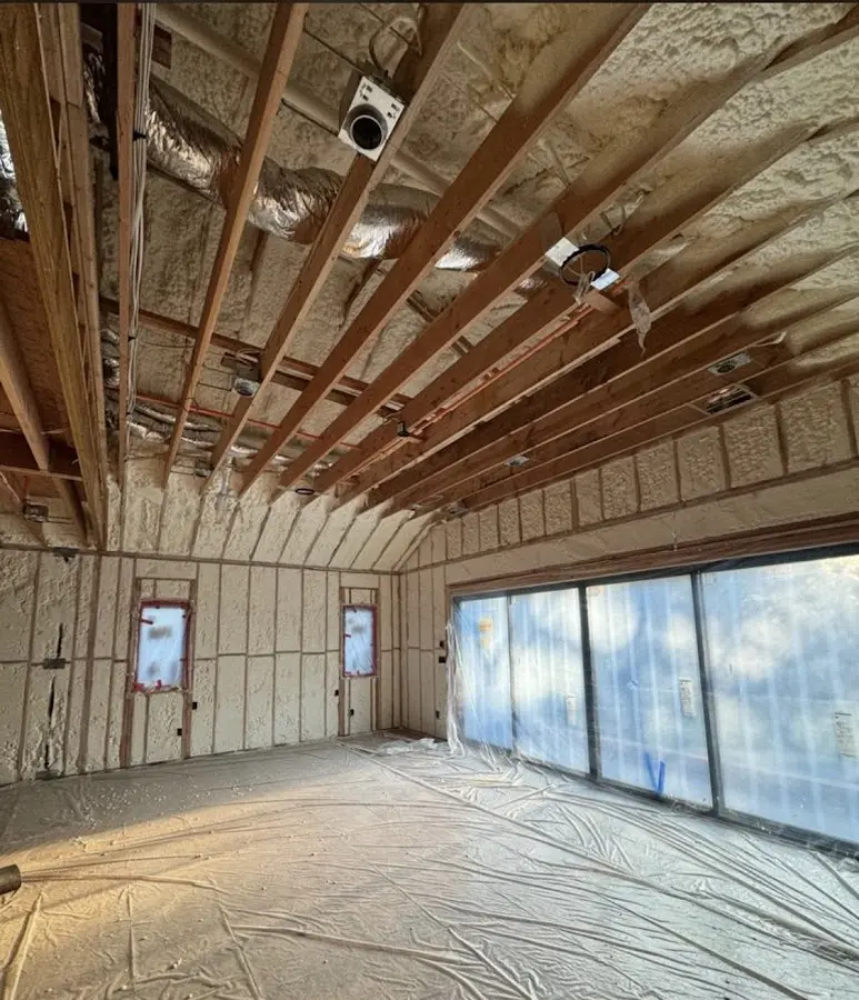 Interior walls and ceiling insulated with spray foam during new construction in Waterloo